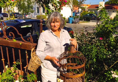 Nicola in garden with birdcage